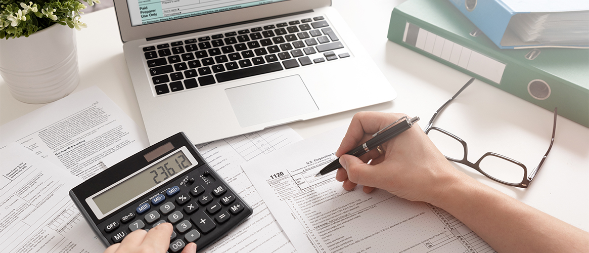 Man calculating business figures and amounts.