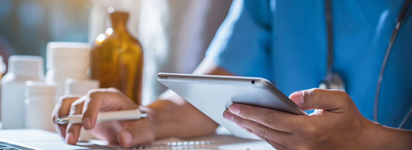 Doctor working on a tablet